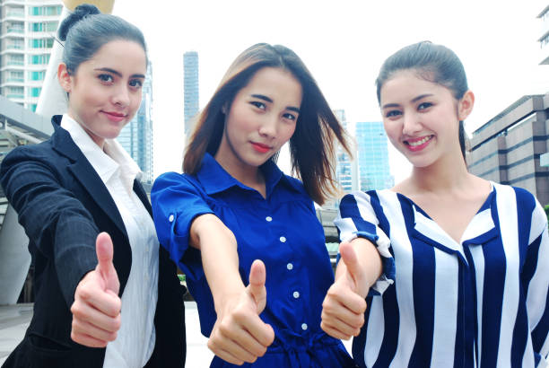 istock Beautiful women Join hands business concept and handshake concept 1032040598