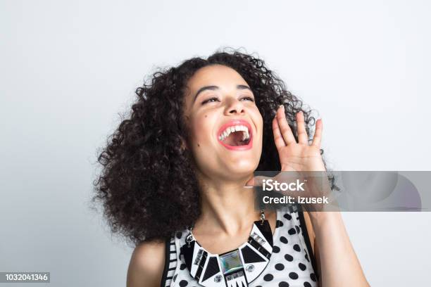 Excited Young Woman Shouting Stock Photo - Download Image Now - 20-24 Years, Adult, Adults Only