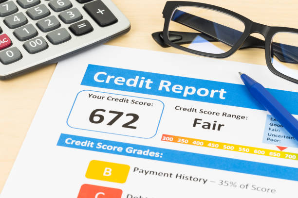 istock Fair credit score report with pen and calculator 1032041402