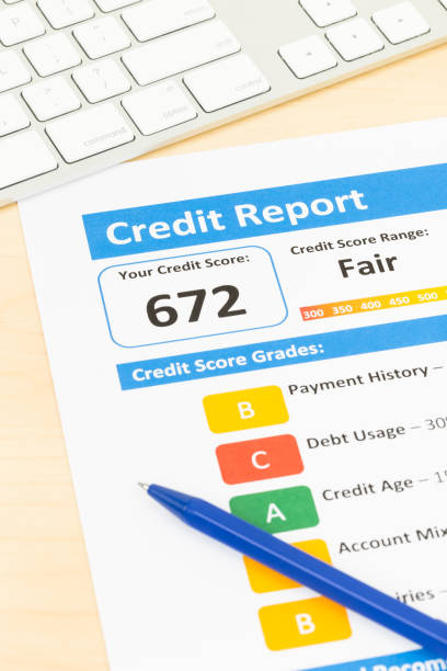 istock Fair credit score report with pen and keyboard 1032041434