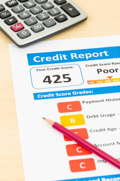 istock Poor credit score report with pen and calculator 1032041500