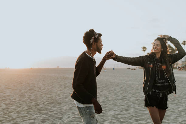 istock Happy couple dancing at the beach 1032041798
