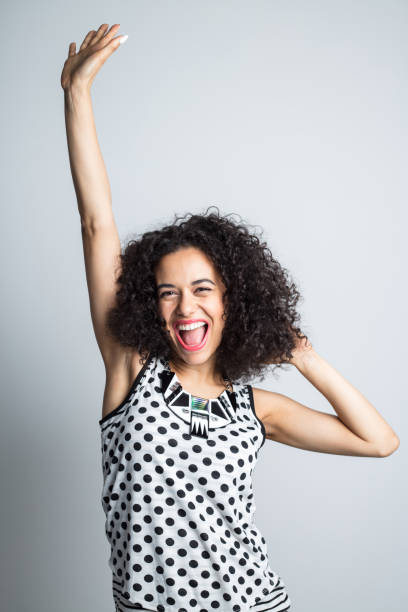 istock Energetic woman celebrating success 1032044362