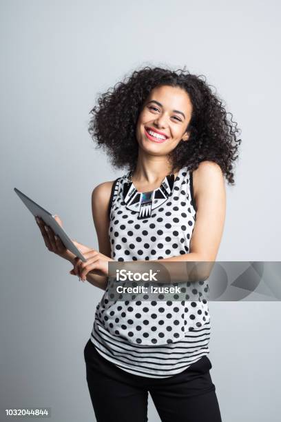 Happy Young Woman With Digital Tablet Stock Photo - Download Image Now - White Background, Digital Tablet, Women