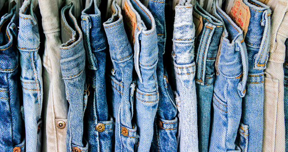 A rack of second hand jeans