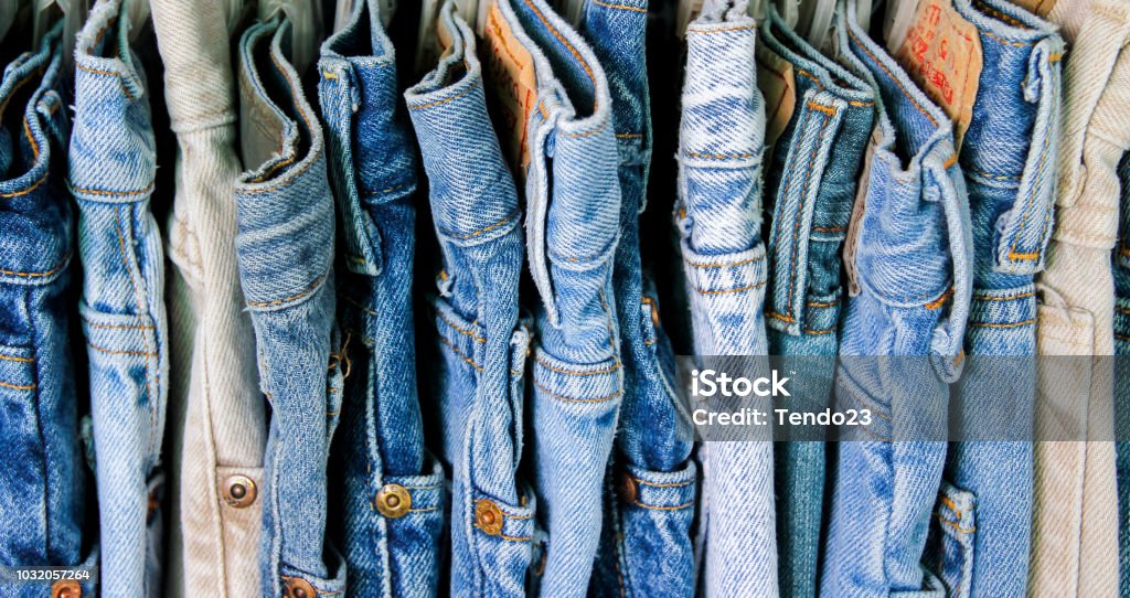 A rack of second hand jeans Jeans Stock Photo
