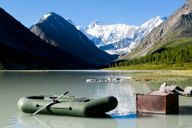 istock Inflatable boat at the lake shore in the mountains. 1032061984