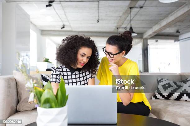 Design Professionals Working On A New Project Stock Photo - Download Image Now - 20-24 Years, Adult, Adults Only