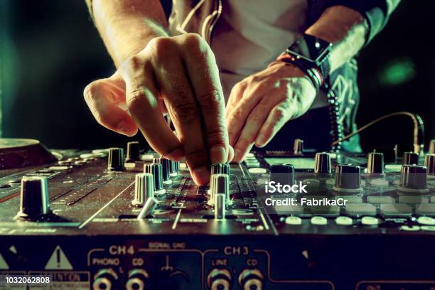 Dj Playing Music At Mixer Closeup Stock Photo - Download Image Now - DJ, Party - Social Event, Turntable