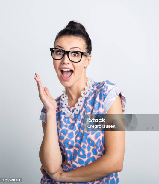 Energetic Young Woman In Eyeglasses Stock Photo - Download Image Now - Surprise, White Background, 20-24 Years
