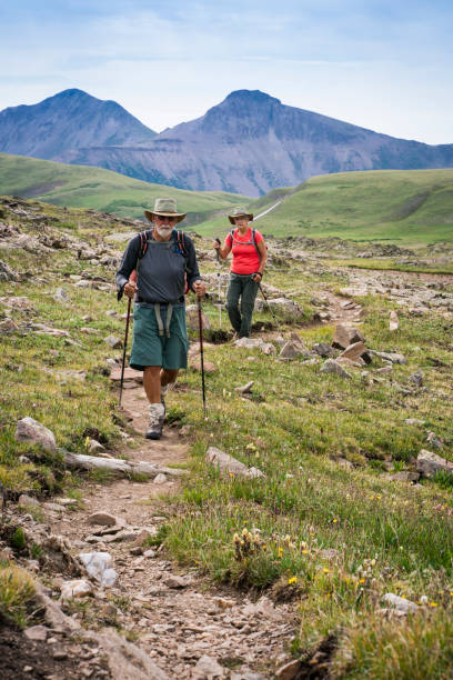 istock Senior couple hiking Continental Divide Trail in CO 1032067302