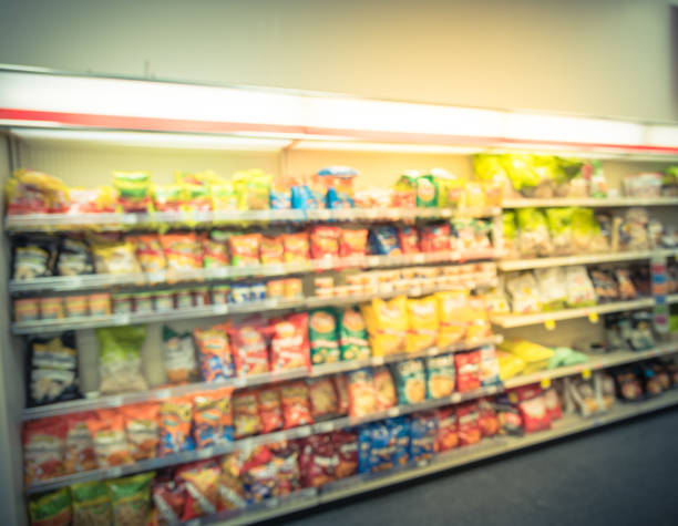 istock Blurry background snacks and canned chips at pharmacy store in America 1032070572