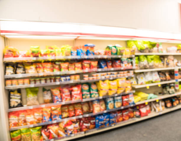 istock Blurry background snacks and canned chips at pharmacy store in America 1032070704