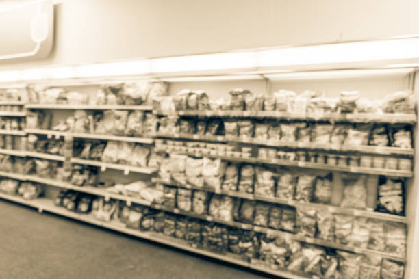 istock Filtered tone blurry background snacks and canned chips at pharmacy store in USA 1032071018