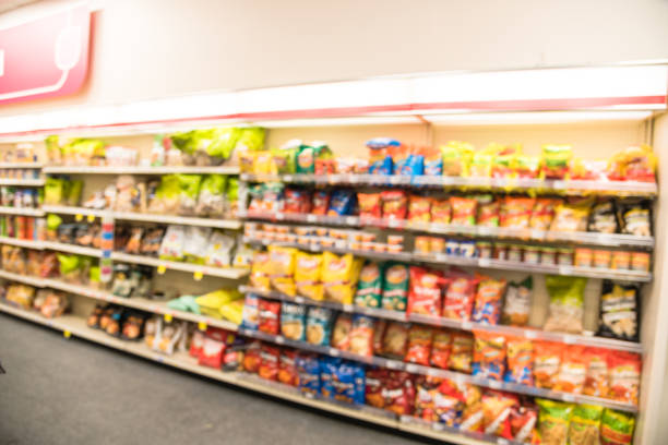 istock Blurry background snacks and canned chips at pharmacy store in America 1032071136