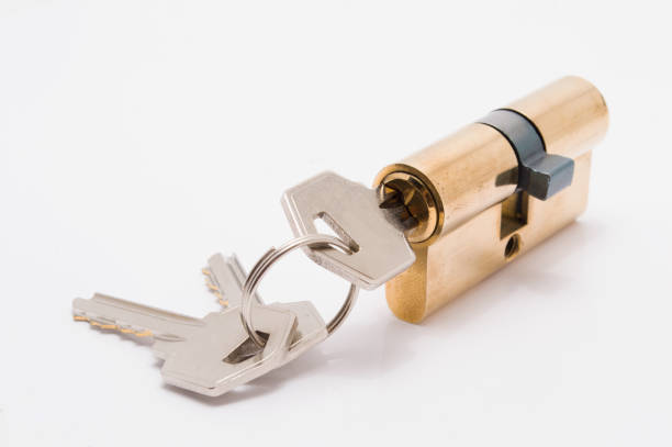 istock door lock cylinder with bunch of keys on white background 1032077580