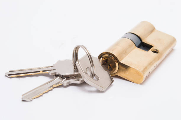 istock door lock cylinder with bunch of keys on white background 1032077584