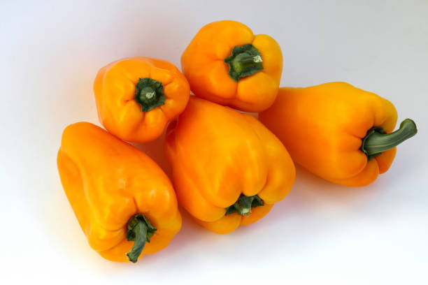 istock Pepper bell fresh and sweet orange colored on isolated white background. Vegetables agricultural products 1032087816