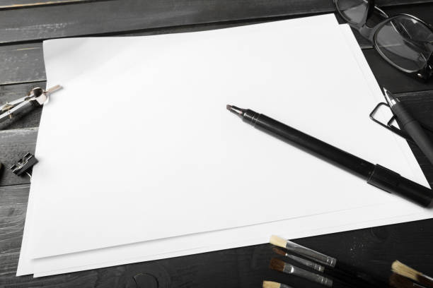 istock Blank notebook and pencil with glasses on wooden table 1032100942
