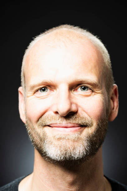 istock Happy middle-aged Caucasian male smiling at camera 1032104192