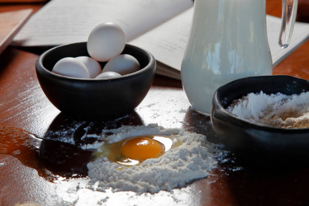 cookbook, eggs and milk - chef cookie dishware domestic kitchen imagens e fotografias de stock