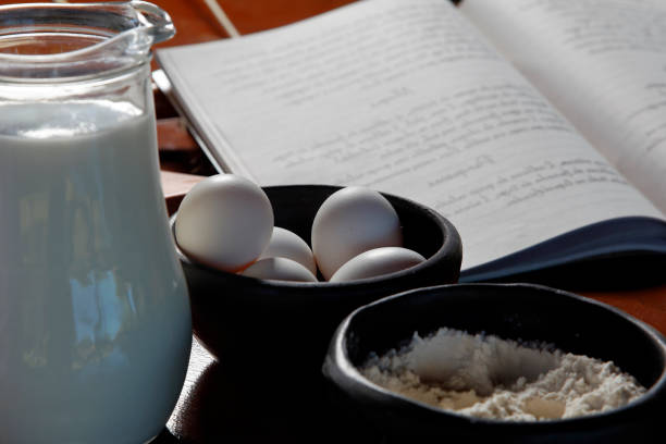 cookbook, eggs and milk - chef cookie dishware domestic kitchen imagens e fotografias de stock