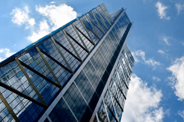 Philadelphia, PA, USA - July 20, 2018;\nContemporary architectural details of tall reflective facades of glass and steel from the office buildings in the business district in Center City Philadelphia, PA on July 20, 2018.