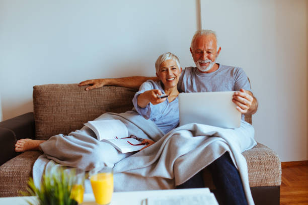 istock Happy senior couple relaxed at home 1032132728