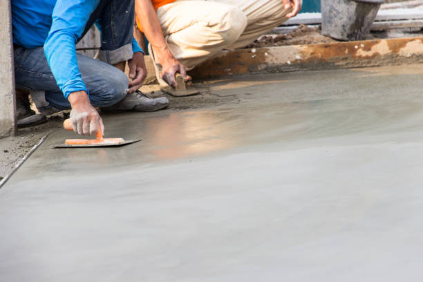 istock Low Section Of Masons Working At Construction Site 1032138904
