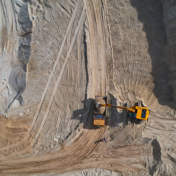 istock Aerial view of sand quarry with bulldozer 1032146046