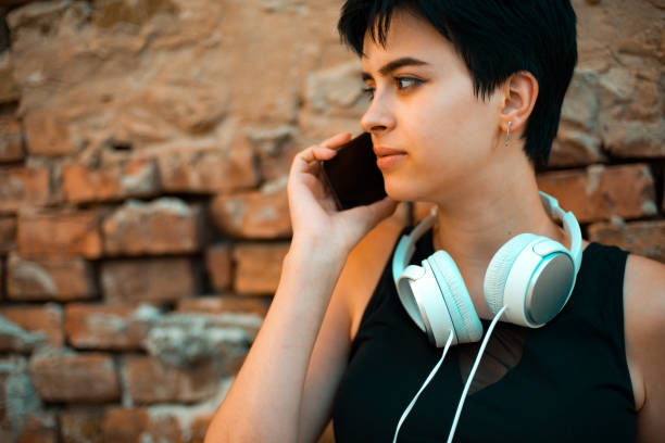 sad young female girl talking on her phone - one person child serene people failure imagens e fotografias de stock