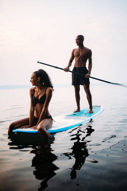 istock Young Couple Paddleboarding Puget Sound in Summer 1032154586