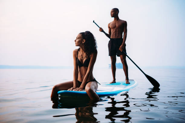 istock Young Couple Paddleboarding Puget Sound in Summer 1032154662