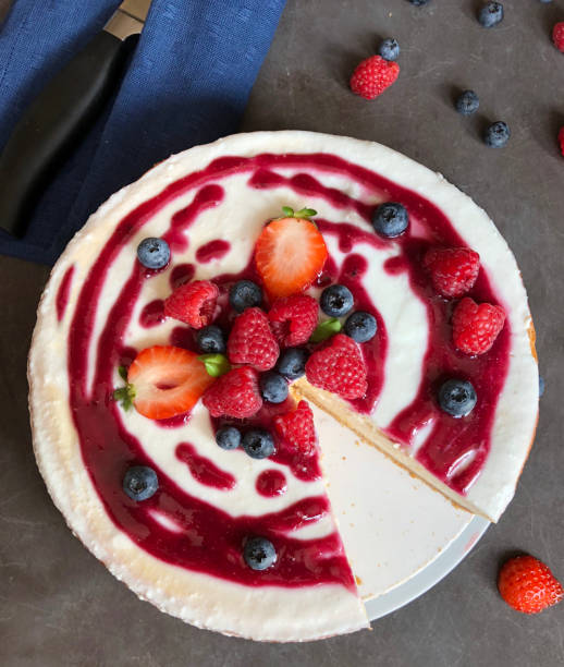 istock Cheesecake with berries on top and coulis 1032162520