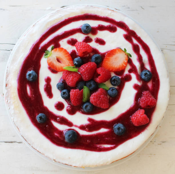 istock Cheesecake with berries on top and coulis 1032162602