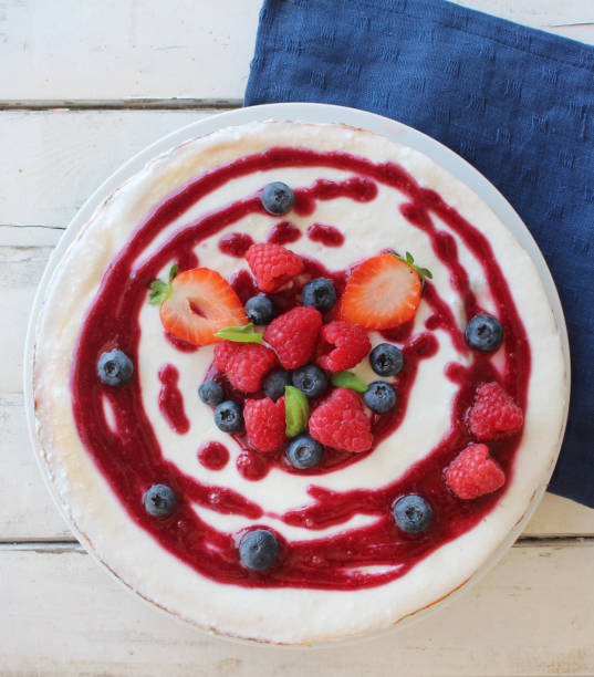 istock Cheesecake with berries on top and coulis 1032162614