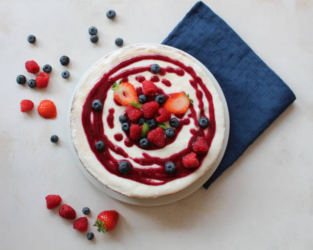 istock Cheesecake with berries on top and coulis 1032162626