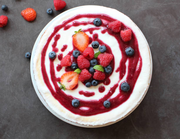 istock Cheesecake with berries on top and coulis 1032162670