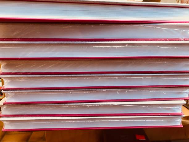 red books stack - workbook paperback book stack stock-fotos und bilder