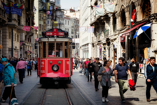 ISTANBUL, TURKEY - MAY 02, 2018: the old tram and people walking in Taksim on May 02, 2018 on Istanbul, Turkey