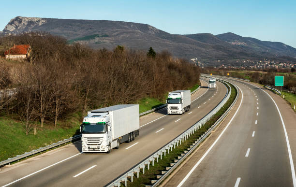 istock Fleet or convoy of trucks on highway 1032178240