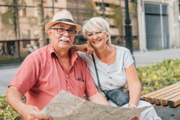 istock Happy couple holding touristic map 1032178390