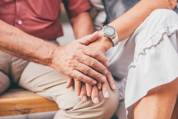 istock Senior couple holding hands 1032179064
