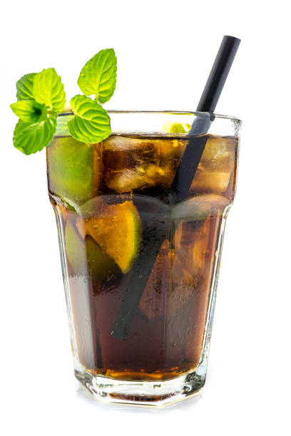 istock Cuba Libre cocktail in glass with straw isolated on white background 1032180292