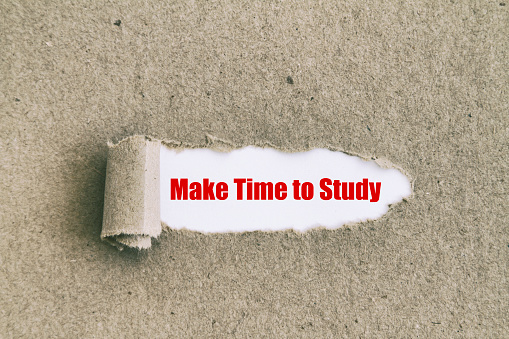 Make time to study written under torn paper.