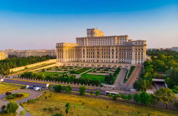 Parliament building or People's House in Bucharest city. Aerial view at sunset