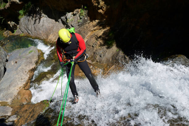 Canyoneering in Pyrenees Canyoning in Otal Valley, Pyrenees, Huesca Province, Aragon in Spain. neoprene photos stock pictures, royalty-free photos & images