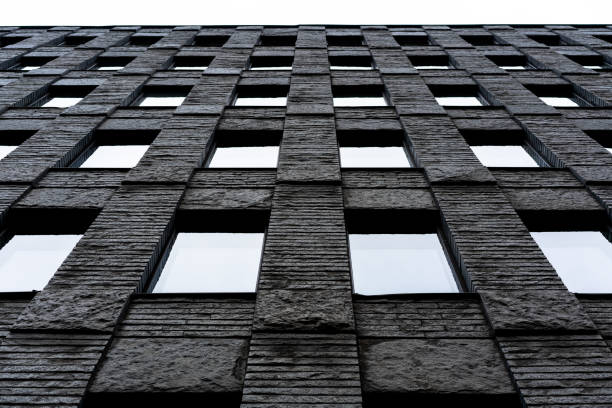 Office stone building with windos from the ground and up