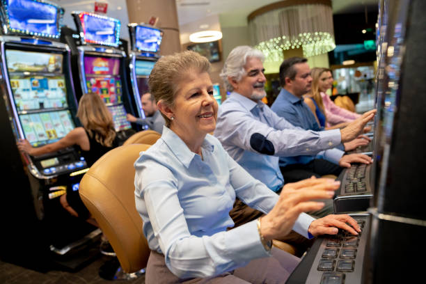 Woman Playing Slots Stock Photos, Pictures & Royalty-Free Images - iStock