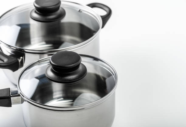 istock Stainless steel pots and pans isolated on white 1032204296